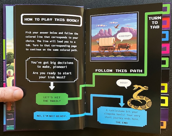 A two-page spread with a choice panel: "Are you ready to start your Trek west?" The first choice, "Let's hit the trail!", leads to a path running off the top right edge of the page. The second choice, "No, I'm not ready," leads to a dead end: "A rattlesnake bit your slowpoke heels!"