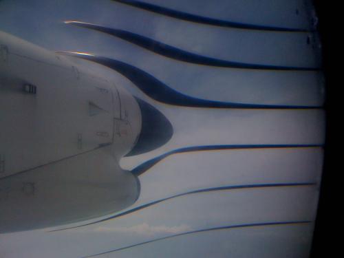 The front of a turboprop nacelle, showing the propellor, but the propellor is distorted into strange vertical ribbons that don't seem to touch the shaft.